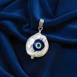 Baroque pearl pendant decorated with evil eye detail 