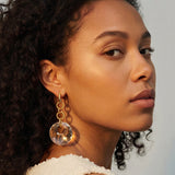 Clear Swarovski Victory crystal long-drop earrings with 18mm crystals and gold-plated sterling silver huggie hoops by Marj Silver.