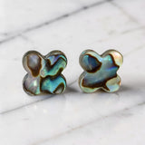 Clover-shaped abalone stud earrings with sterling silver posts, iridescent shell design, handmade 12mm everyday earrings.