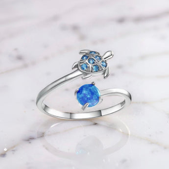 Sterling silver turtle open ring with blue opal