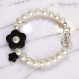black onyx floral bracelet with pearl centre