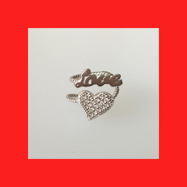 Sterling silver heart and love ear cuff with cubic zirconia, designed for the right ear.